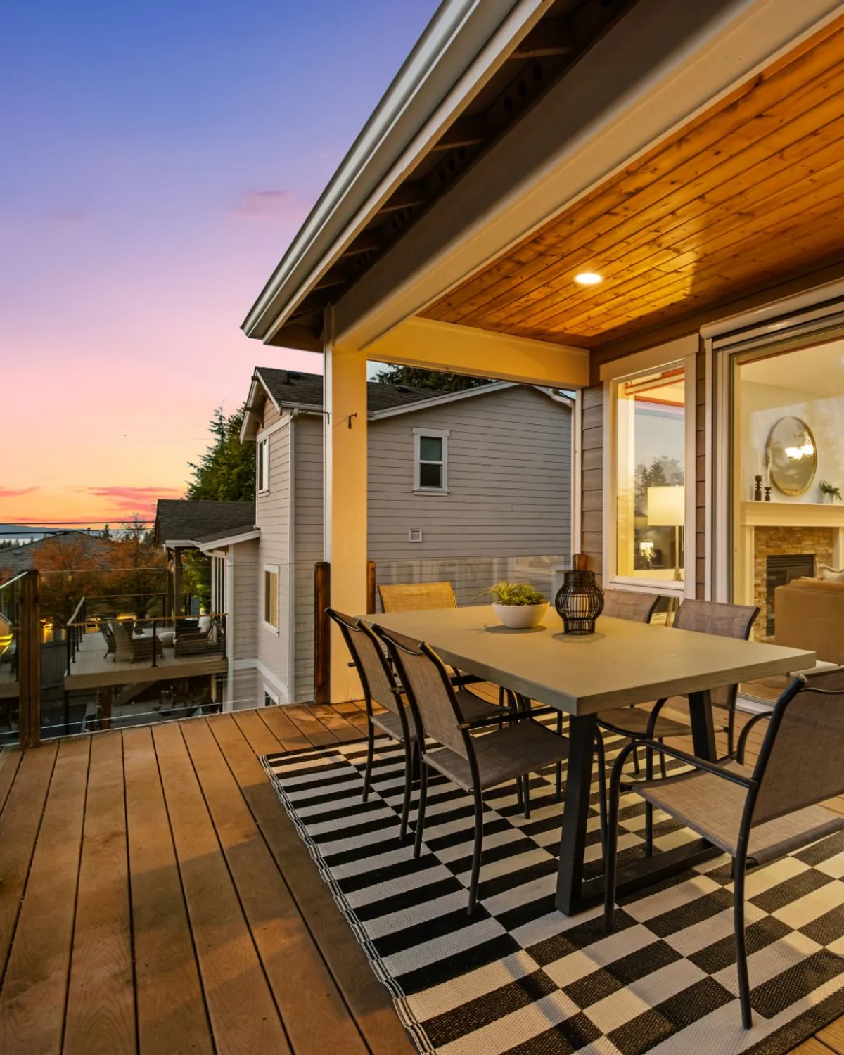 Sunset view from a covered deck overlooking neighboring homes